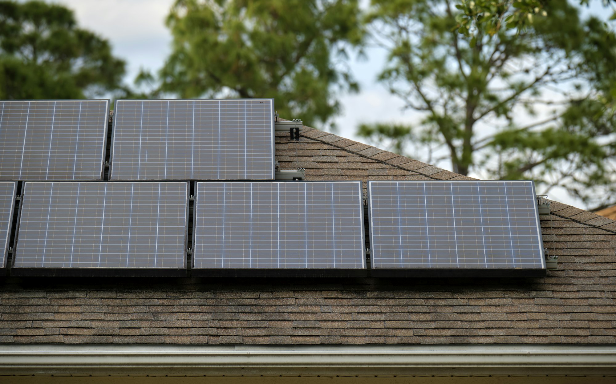 Residential house with rooftop covered with solar photovoltaic panels
